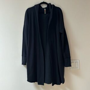 Used black long sweater jacket, has pockets and a hood